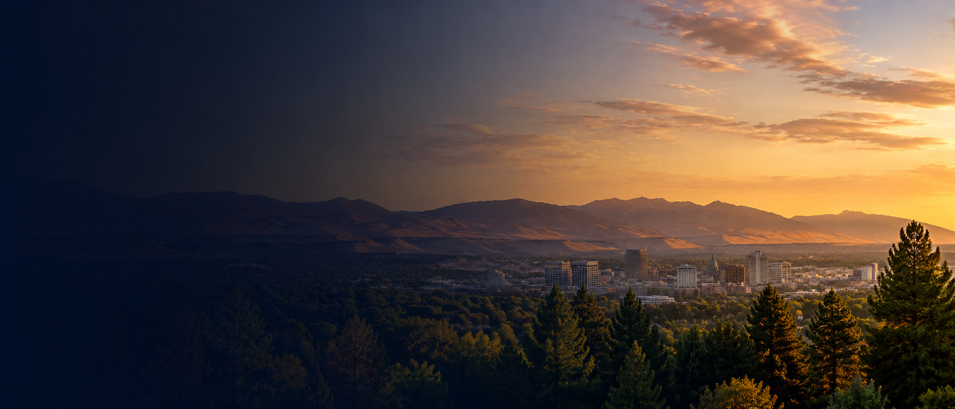 Boise, Idaho cityscape at dusk with the Treasure Valley mountains behind it